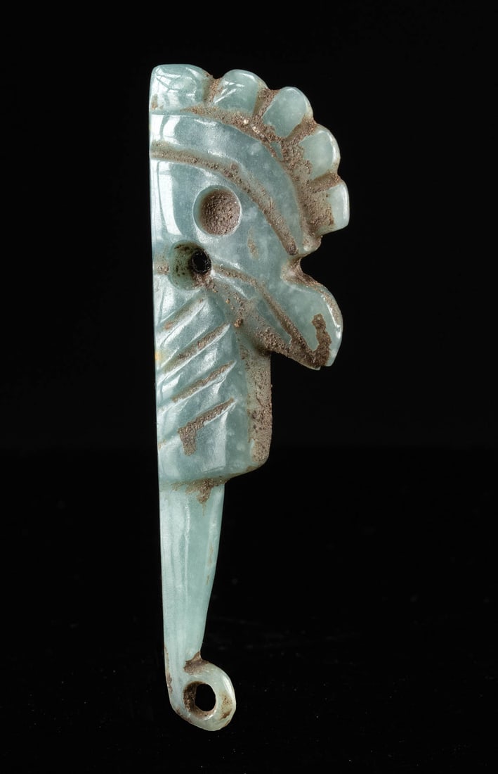 Superb Ancient Costa Rica Jadeite Bird Pendant: Pre-Columbian, Central America, Costa Rica, Guanacaste/Nicoya region, ca. 200 to 600 CE. This jadeite pendant is carved in the form of a stylized bird and pierced for suspension. The stone displays a