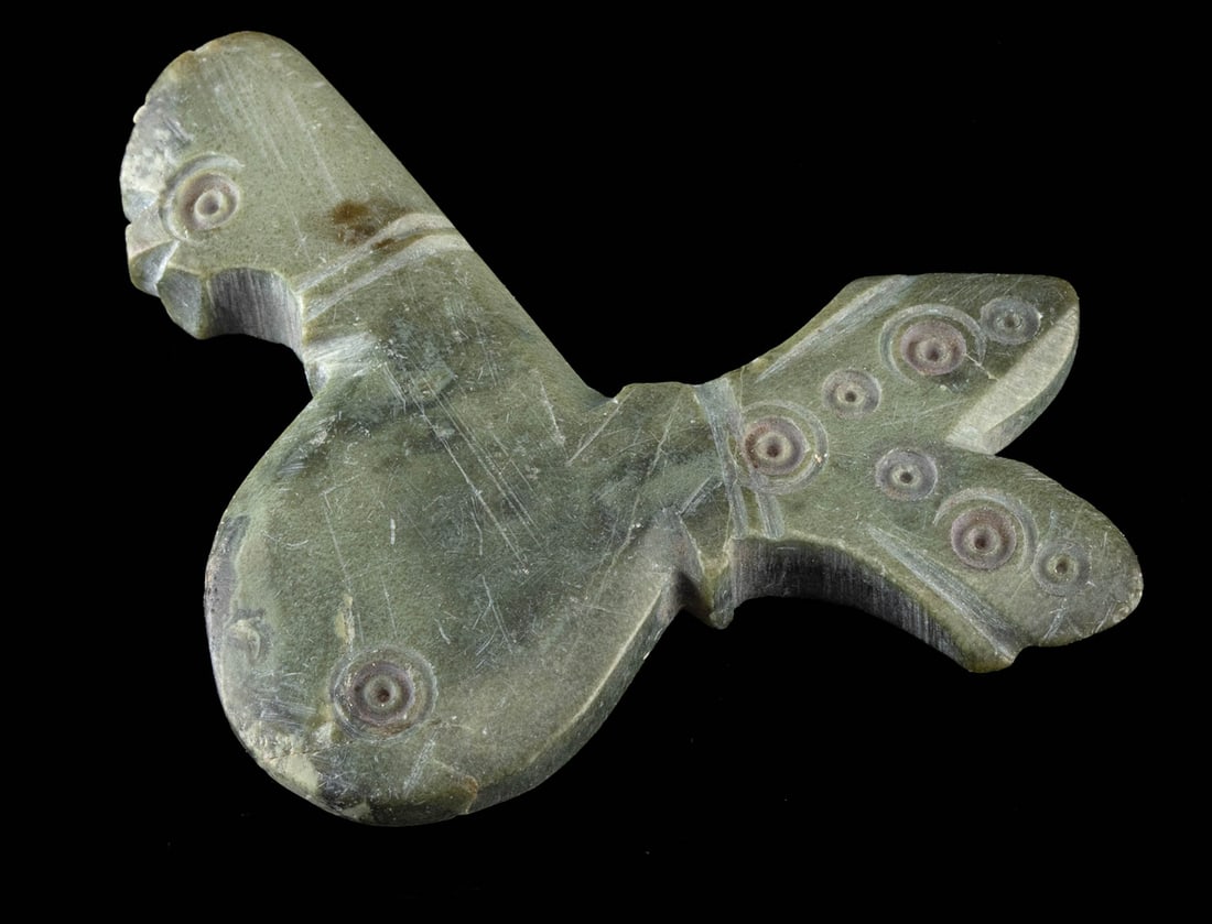 Rare 10th C. Seljuk Stone Kohl Flask - Stylized Rooster: Near East, Islamic world, Persia, Seljuk period, ca. 10th to 12th century CE. A compact and delightfully stylized stone kohl flask carved in the form of a rooster, its rounded body and bifurcated tail