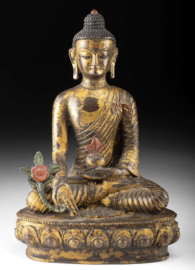 Tibetan Brass Medicine Buddha, Holding Healing Plant: Central Asia, Tibet, ca. mid-20th century CE. This cast brass sculpture depicts the Medicine Buddha seated in a meditative posture, holding a bowl of healing herbs and a myrobalan plant, symbols of ph