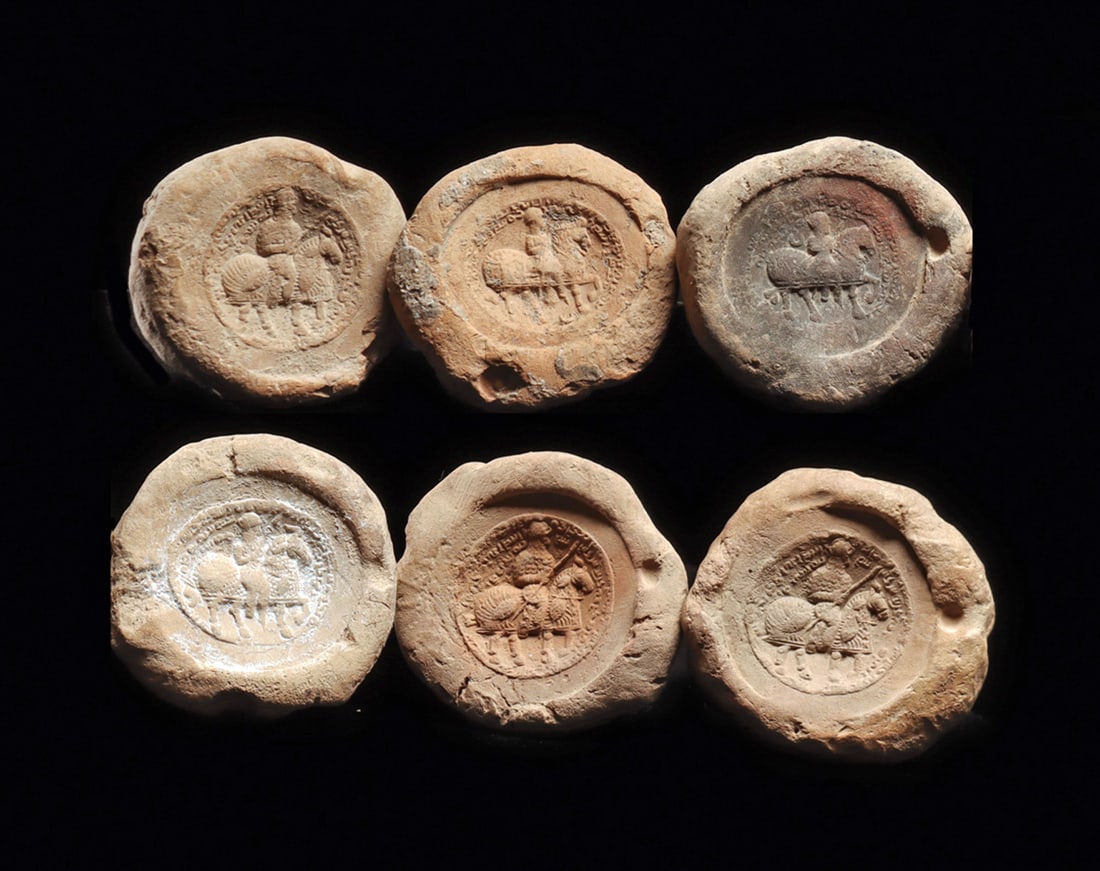 Sasanian Bullae with Horse & General (6): Six similar pottery bullae, each originally attached to a document or merchant bundle, all are impressed with a mounted horse and general and holding a spear, horses wearing protective armor. Inscript