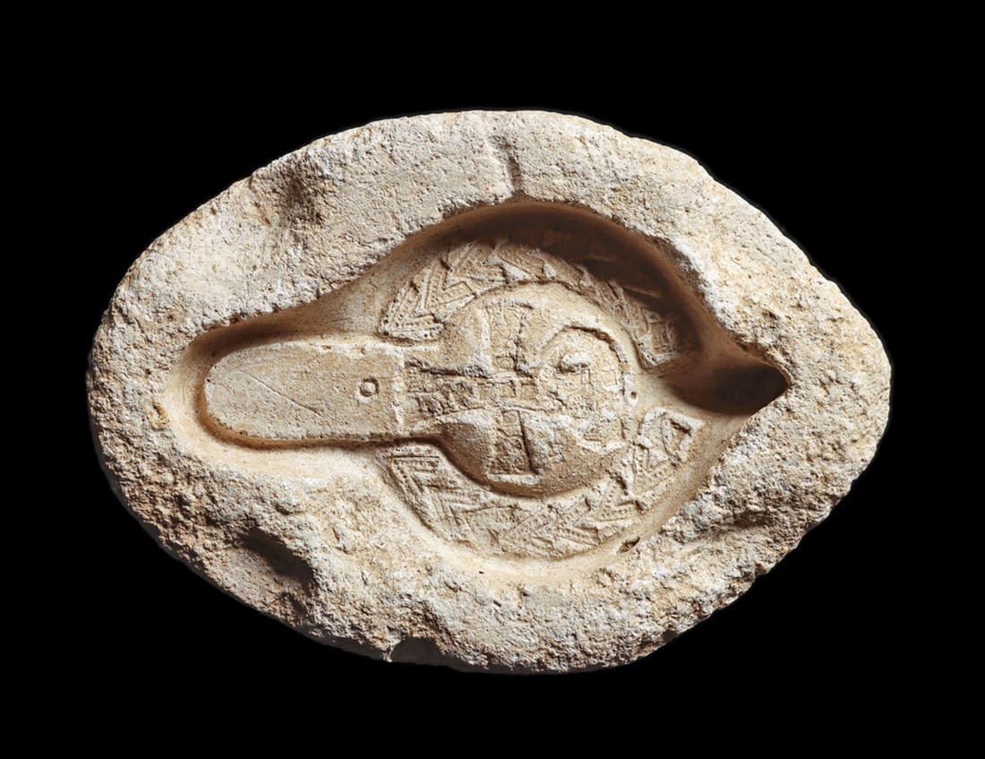Byzantine Pottery Oil Lamp Mold: Limestone mold for the upper portion of an oil lamp, having a decoration consisting of a large central cross with a large leafy branch on the outer border. Ancient losses around the upper mold rim, ot