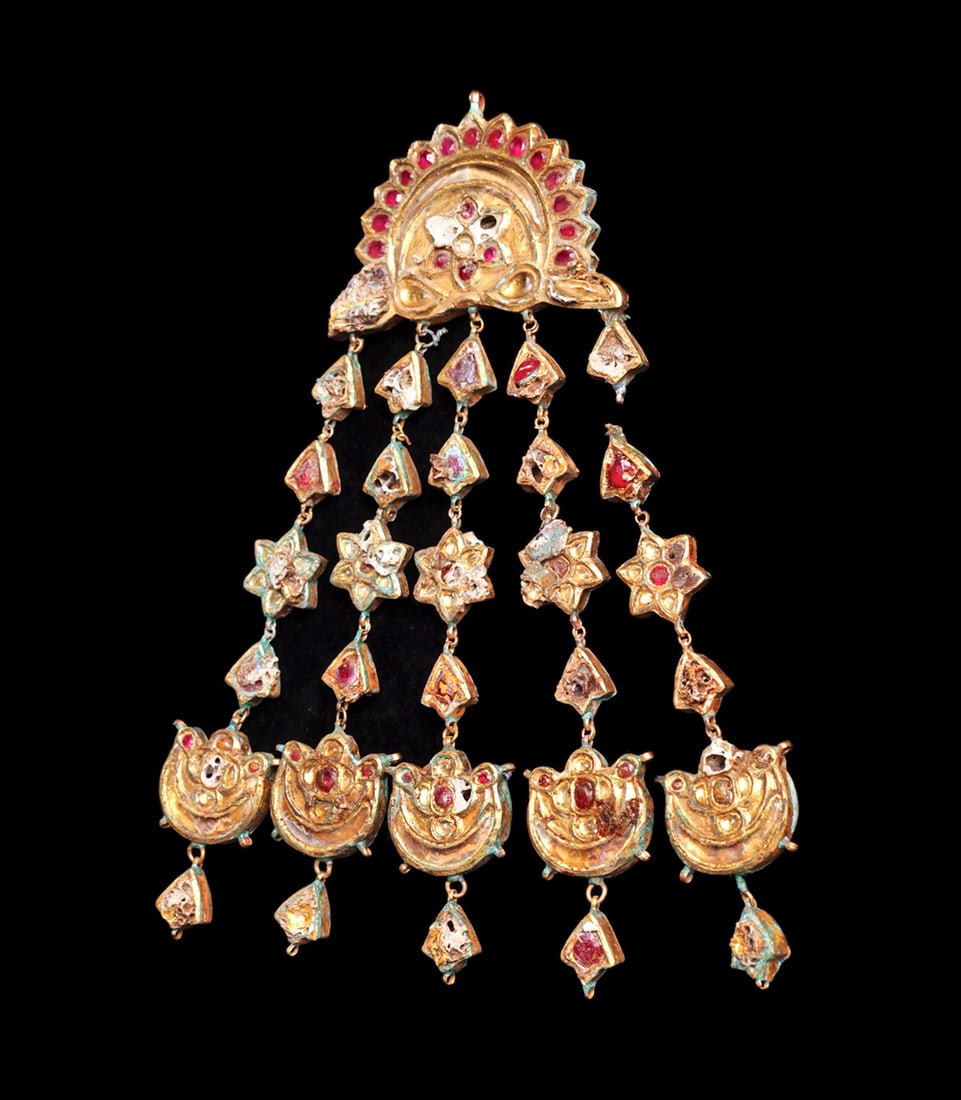 Mughal Gold Pendant with Rubies & Rock Crystal: Gold pendant having five long multi piece danglers, all set with rubies and rock crystal stones. Design elements consisting of crescent moons, six-pointed stars and floral elements. Overall scattered