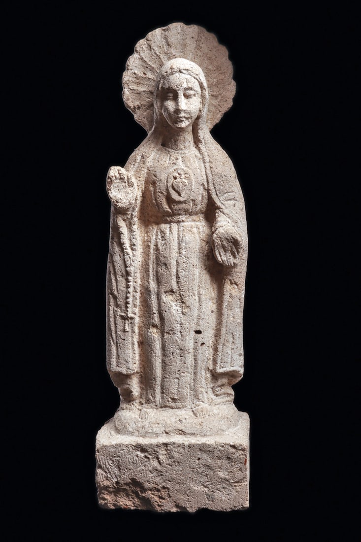 Colonial Peruvian Limestone Statue of Blessed Mary: Carved limestone statue depicting the Blessed Mary, holding her hands in different directions, palms face outwards. According to AI: "The posture where saints or figures hold their palms facing outwar