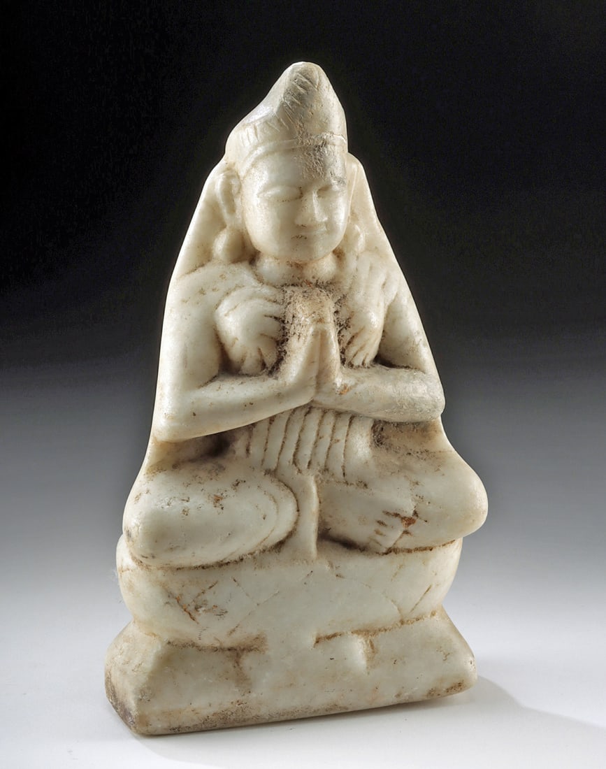 Tibetan Marble Figure of Tara in Anjali Mudra: Central Asia, Tibet, ca. 18th to 19th century CE. A serene Tibetan marble sculpture depicting a seated Hindu female deity, likely Tara, shown in calm meditation with hands pressed together in anjali m