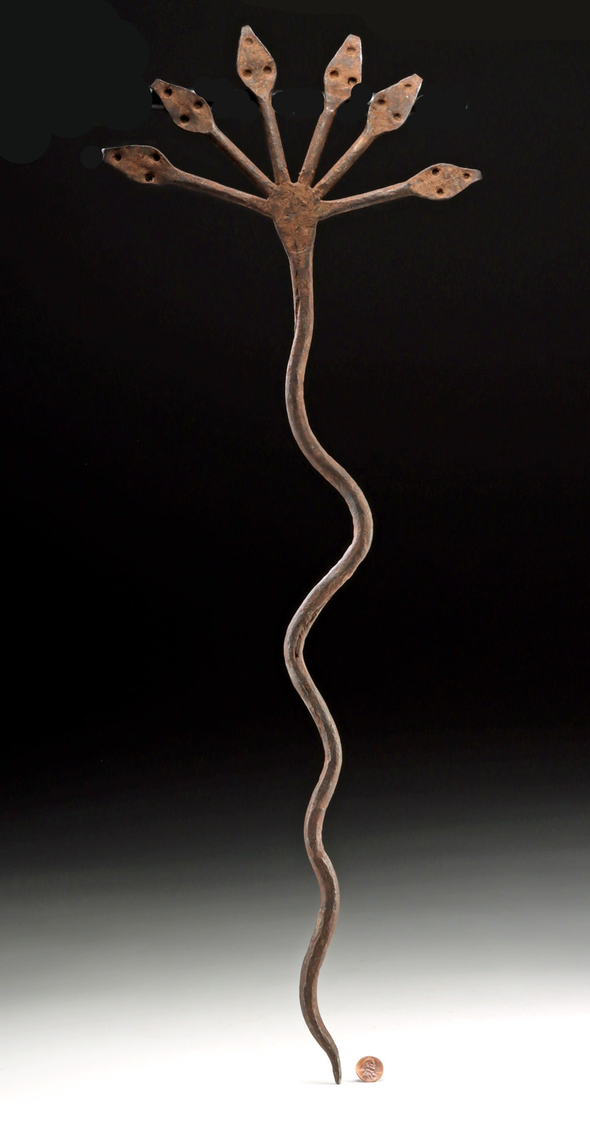West African Lobi Iron Multi Headed Snake Staff: West Africa, Burkina Faso, Gan or Lobi peoples, ca. early to mid-20th century CE. A forged iron staff formed as a sinuous serpent, the long body rising to a finial with six snake heads. In Gan and Lob