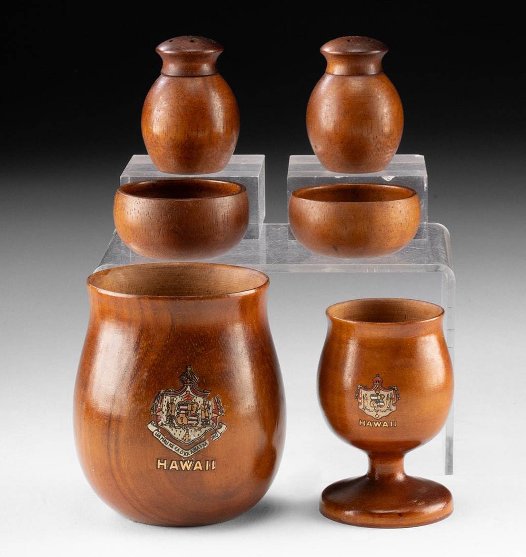 Hawaiian Koa Wood Vessels & Salt Shakers, 6 pcs: North Pacific, Hawaii, ca. early to mid-20th century CE. A collection of turned wood vessels, likely koa, comprising a larger cup, a stemmed shot glass, a pair of salt and pepper shakers, and two