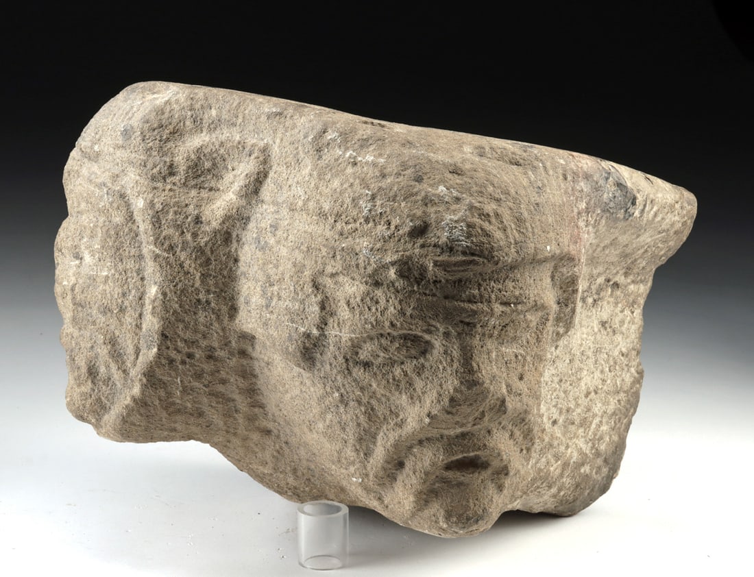 12th C. Medieval Stone Corbel with Dual Faces: Europe, Medieval period, ca. 12th to 14th century CE. A compact block of carved stone animated by two opposing faces, this medieval European corbel blurs the boundary between architecture and imaginat