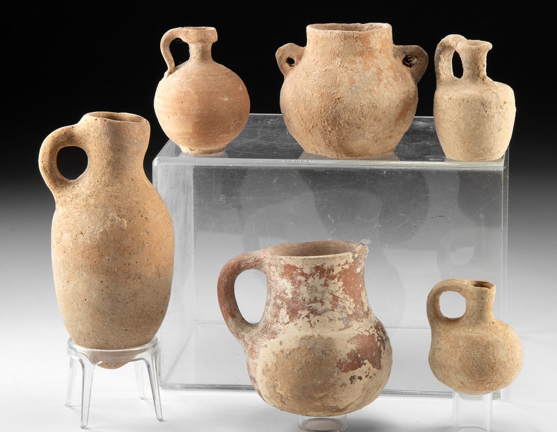 Ancient Holy Land Pottery - Six Vessels: Ancient Near East, Levant, Holyland, ca. 1st millennium BCE to early 1st millennium CE. A handsome and varied group of six Holy Land pottery vessels, embodying the enduring ceramic traditions of the a