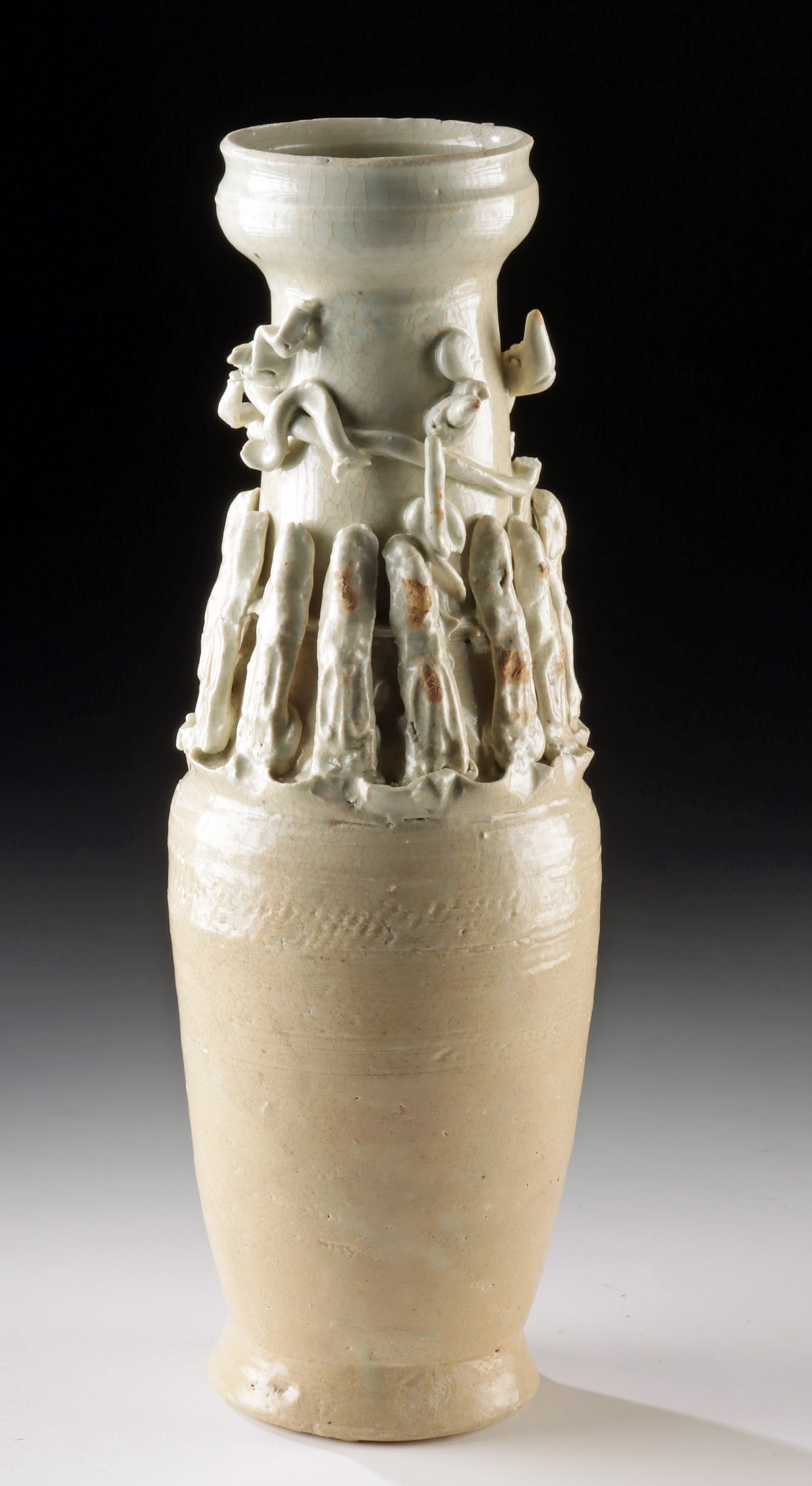 Song Dynasty Qingbai Funerary Jar w/ Celestial Figures: East Asia, China, Southern Song Dynasty, ca. 13th century CE. A graceful testament to both craft and belief, this tall porcelain funerary jar is cloaked in a luminous pale blue qingbai glaze, a hallma