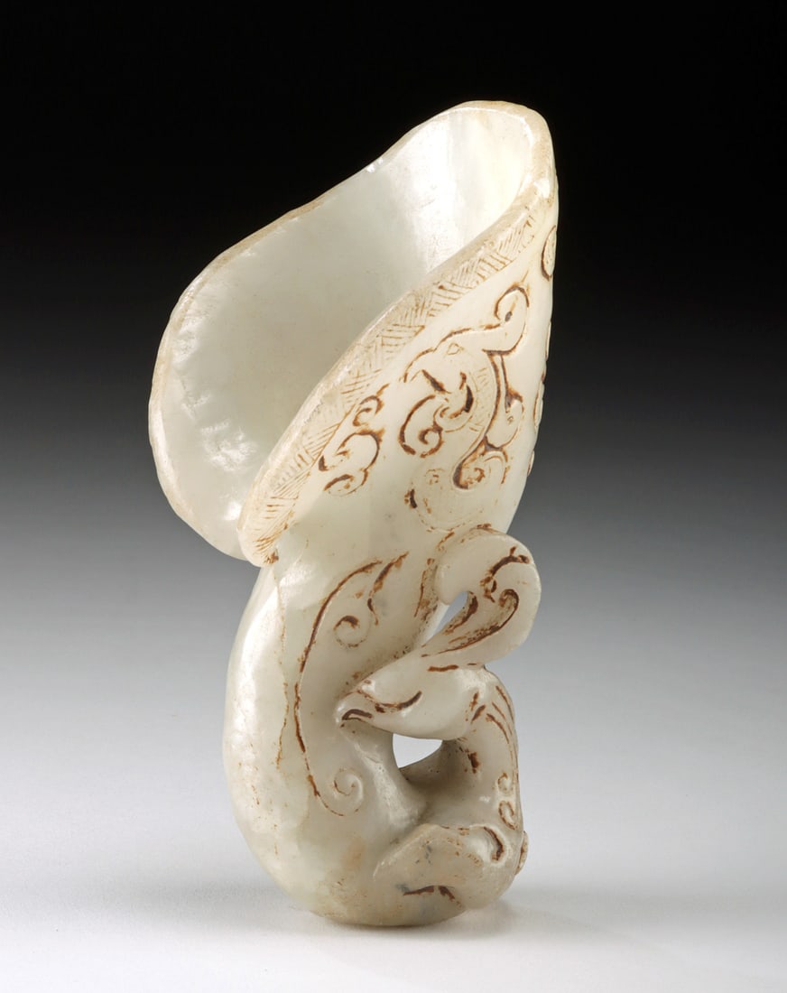 18th C. Chinese White Jade Rhyton - Chilong / Birds: East Asia, China, Qing Dynasty, ca. 18th to 19th century CE. This white nephrite jade rhyton evokes the ceremonial vessels of the Shang and Zhou dynasties while showcasing the refined tastes of the Qi