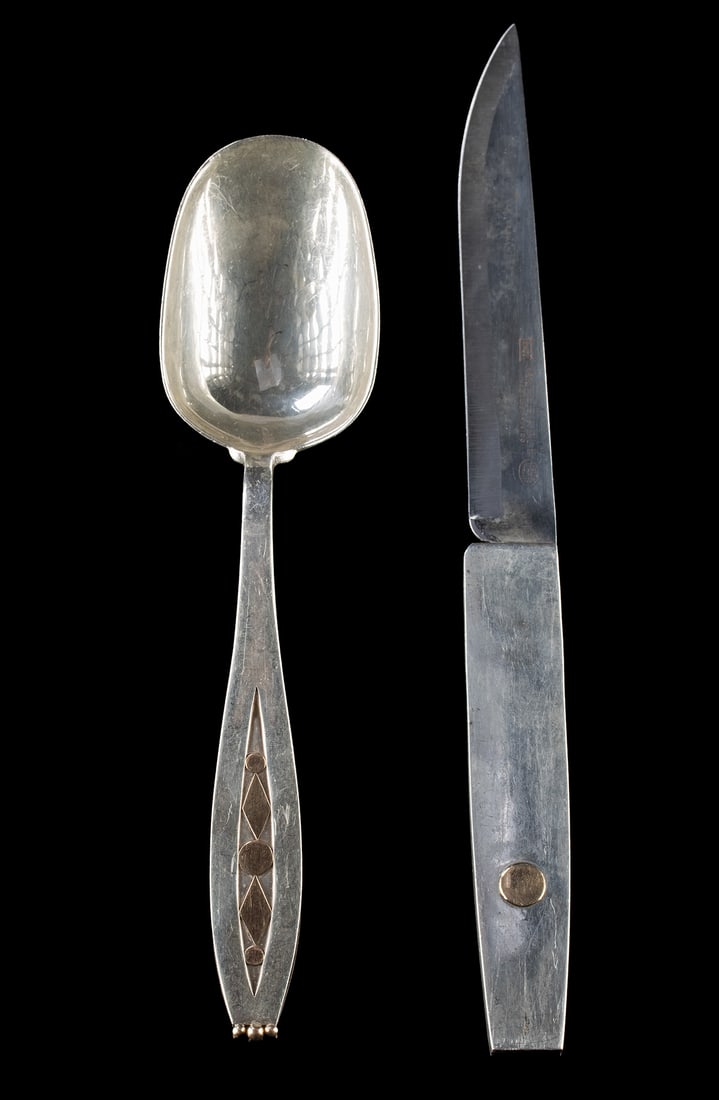 Spratling Gilt Silver Flatware Knife & Serving Spoon: Latin America, Mexico, ca. mid to late 20th century CE. A sterling silver table knife and serving spoon with gold gilt accents from the William Spratling workshop. The knife features a tapered silver