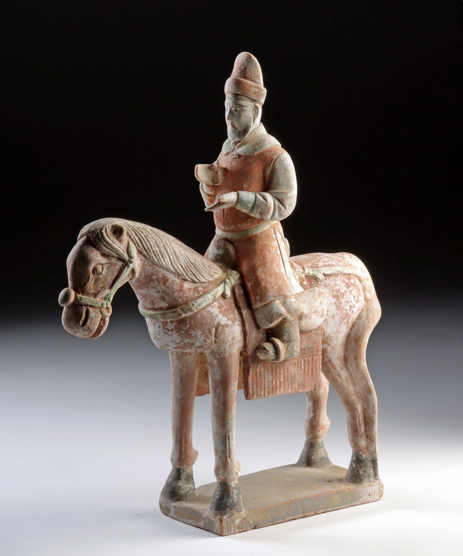 Chinese Ming Dynasty Polychrome Equestrian Figure: East Asia, China, Ming Dynasty, ca. 1368 to 1644 CE. A dignified horse stands at ease while its rider gestures mid-thought, frozen in a moment that feels administrative, ceremonial, or quietly authori