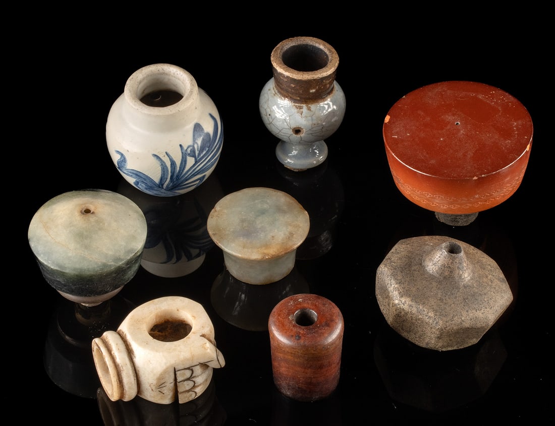 Chinese Pottery & Stone Smoking Pipe Bowls & Fittings: East Asia, China, Qing Dynasty, ca. 19th to mid-20th century CE. A varied group of smoking pipe bowls and fittings assembled in an array of materials including pottery, ivory, jade, and stone. The pot