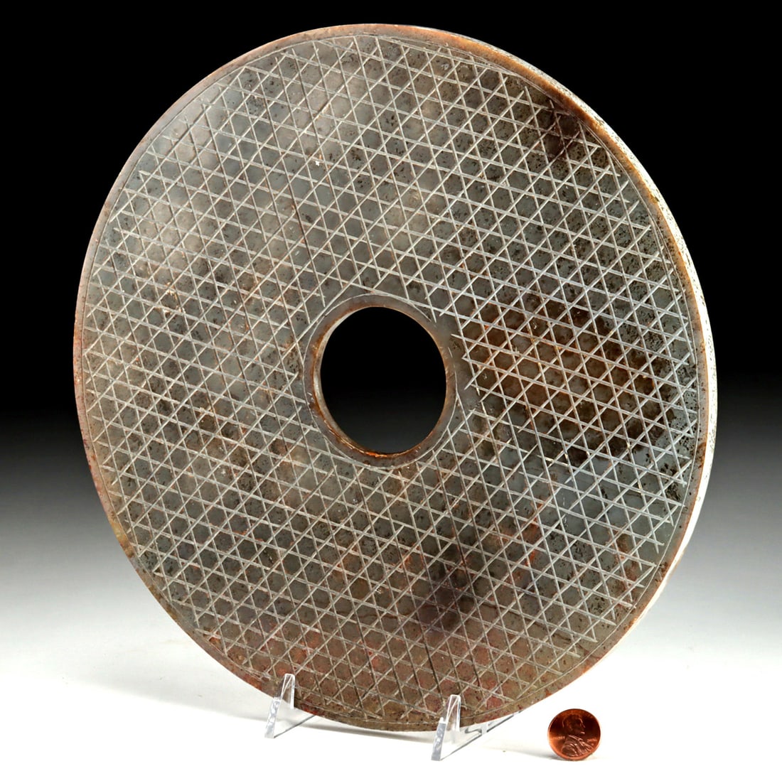 Late Qing Archaistic Gray Stone Bi Disc: East Asia, China, late Qing dynasty to Republic period, ca. early to mid-20th century CE. A large Chinese archaistic bi disc carved from dense gray stone, modeled after ancient ritual jades associated