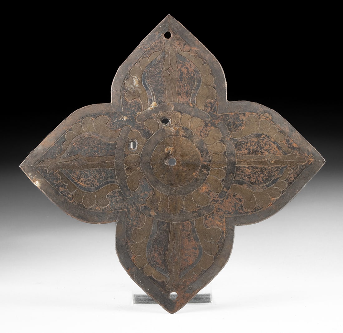 Tibetan Brass Lock Panel - Repousse Floral Motif: Central Asia, Tibet, ca. 19th century CE. A richly worked Tibetan brass locking mechanism panel, shaped in an elegant quatrefoil and ornamented with a stylized floral medallion that reads like a lotus