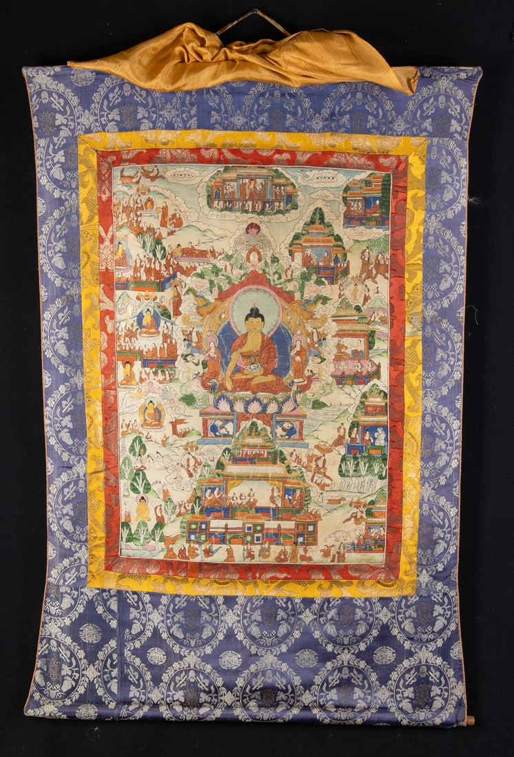 Large Tibetan Thangka Silk Tapestry Painting of Buddha: Central Asia, Tibet, ca. early to mid-20th century CE. A vibrant thangka painting, finely rendered in polychrome pigments on canvas and mounted within a silk brocade surround. The central image depict