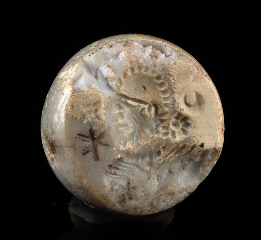 Sasanian Stone Amulet with Possible King Portrait: Ancient Near East, Persia, Sasanian period, ca. 3rd to 7th century CE. A Sasanian stone stamp seal bead carved with the head of a male figure, presented in profile and rendered with confident, abbrevi