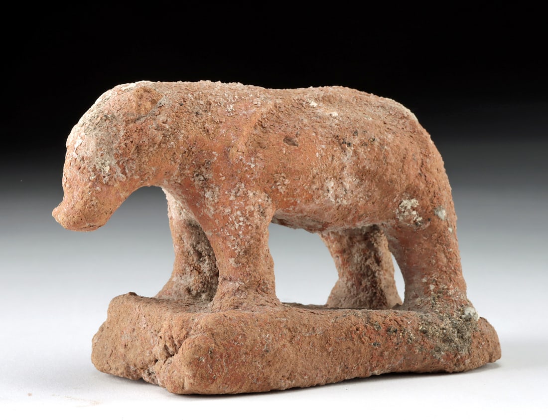 Rare Egyptian Pottery Hippopotamus, ex-Bonhams: Ancient Egypt, Middle Kingdom, 11th to 13th Dynasty, ca. 2130 to 1650 BCE. An exceedingly rare, hand-built pottery hippopotamus figure standing upon a quartet of sturdy legs atop an integral rectangul