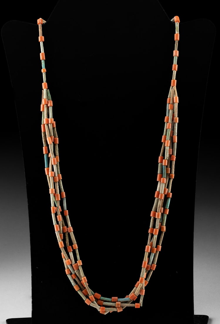 Egyptian Late Period Faience Bead Necklace w/ Coral: Egypt, Late Dynastic Period, ca. 664 to 30 BCE. A vibrant interplay of desert blue and sunlit red, this necklace evokes the color sensibilities of Late Period Egypt while remaining wearable for the mo