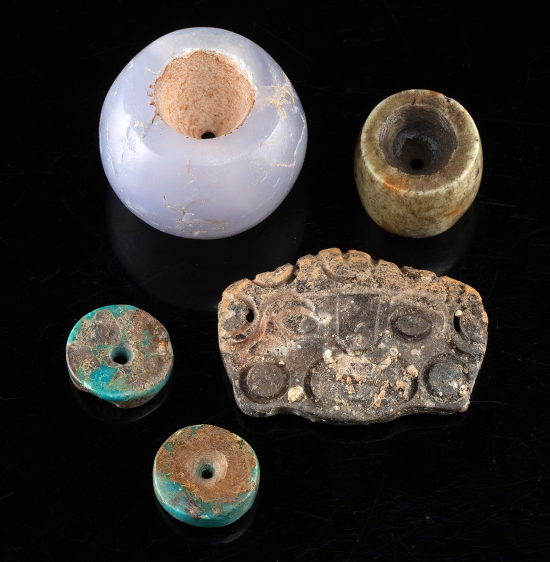Pre Columbian Chrysocolla & Chalcedony Beads: Pre-Columbian, Mesoamerica & Peru, ca. 300 BCE to 1500 CE. A group of 4 stone beads and a stone pendant. The Maya stone pendant features a stylized face wearing earspools. Included are two