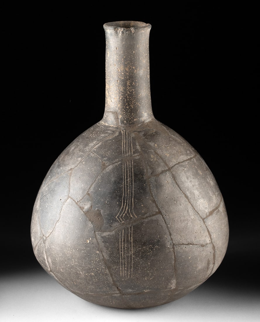 Mississippian Caddo Blackware Water Bottle: Native American, Southeastern United States, Caddo culture, Mississippian period, ca. 900 to 1600 CE. A finely proportioned Caddo blackware water bottle distinguished by its rounded body, tall neck, a