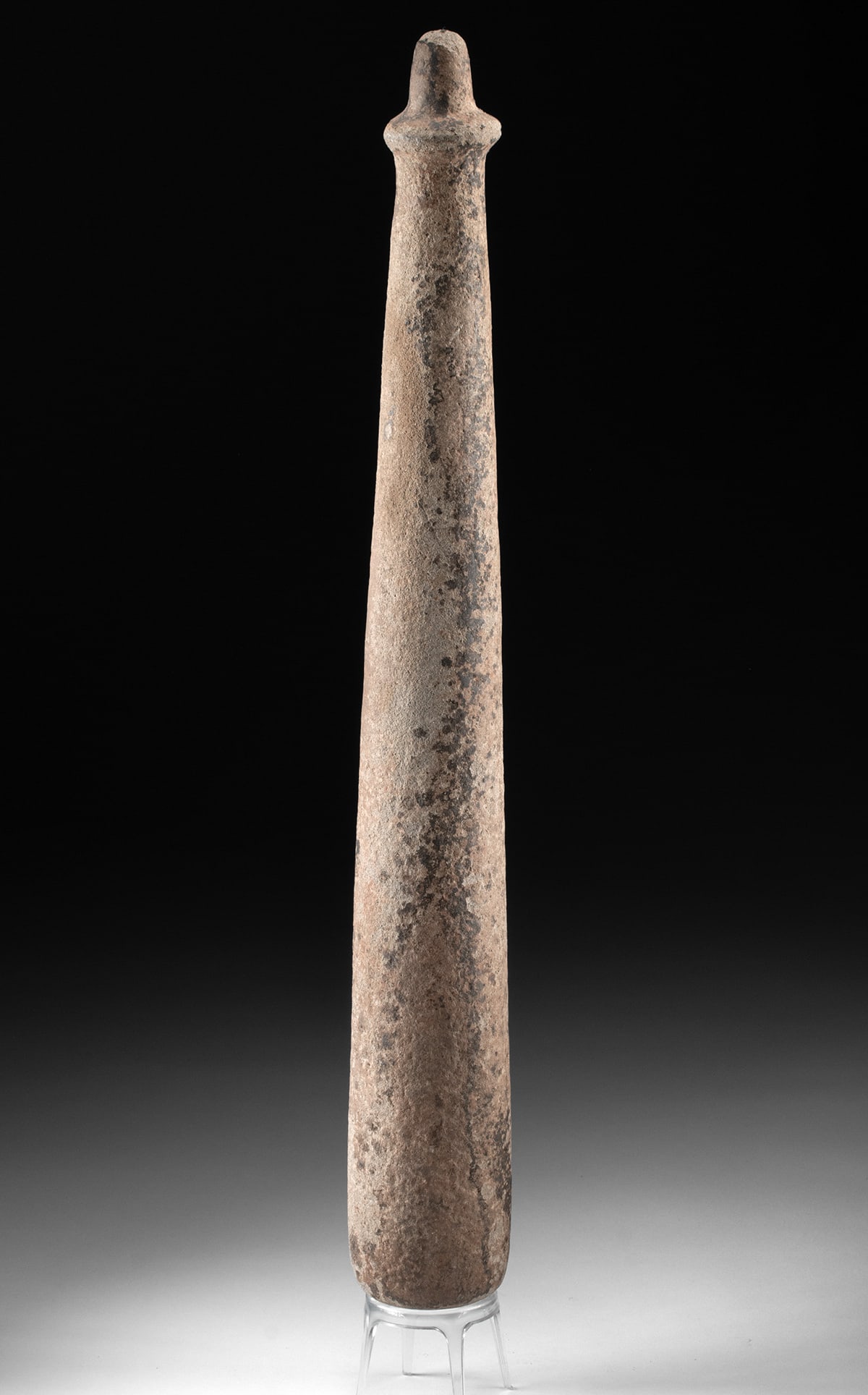 Huge Native American Columbia River Stone Pestle: Native American, Northwestern United States, Columbia River region, ca. 19th century CE. A large Columbia River stone pestle or club, carved in a long tapering form with a rounded working end and a di