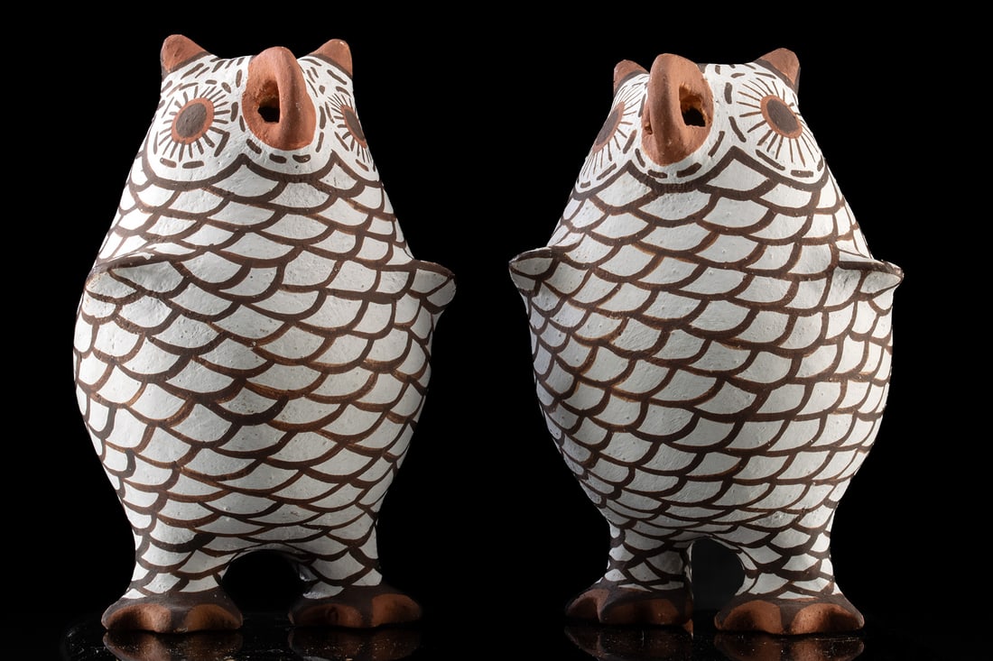 2 Miniature Zuni Pottery Owls by Evelyn Koskela: Native American, Southwestern United States, Zuni, ca. late 20th century CE. A matched pair of miniature Zuni pottery owls modeled in compact standing form with rounded bodies, small ear tufts, and pi