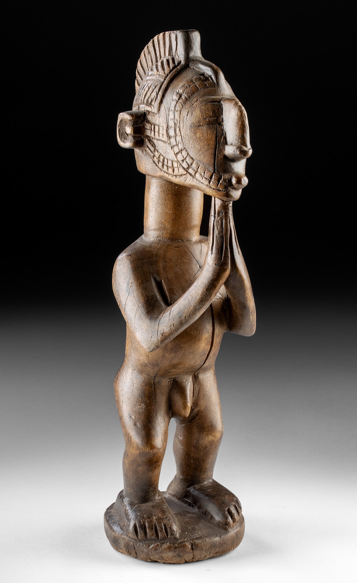 Guinea Baga Wood Nude Male Figure w/ Nimba Headdress: West Africa, Guinea, Baga, ca. 20th century CE. A commanding Baga wood figure stands nude and upright, crowned by the monumental form of a Nimba headdress, also known as D'mba or Yamban. The tall cres