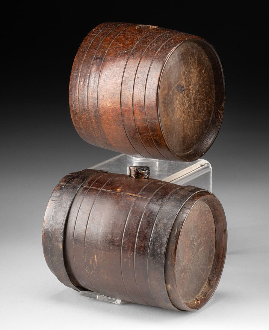 Two European 18th C. Wooden Costrel Travel Canteens: United States or Western Europe, ca. 18th to early 19th century CE. A pair of turned wooden barrel-form drinking vessels, likely made for travel or field use. Each example is carved with evenly