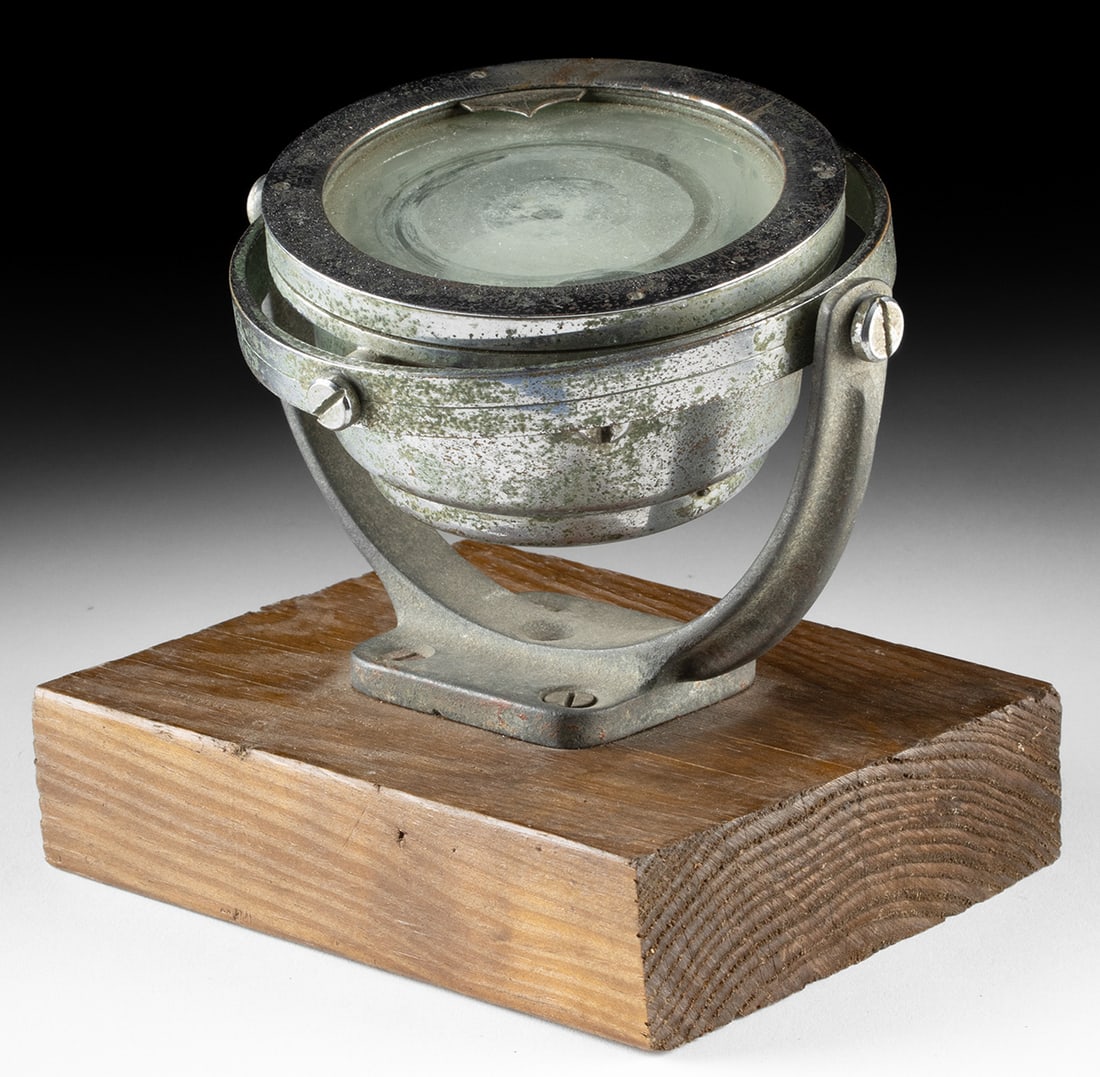 Rare 1930s Gimbal Compass for Russian Military Aircraft: Europe, France / Russia, ca. 1930s CE. A historical nickel-brass gimbal compass mounted on a wooden base, representing an early collaboration between French precision engineering and Russian