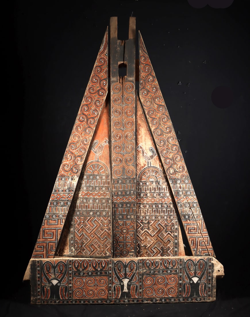 Toraja Painted Wood Rice Barn Gable Panel - Alang Para: Southeast Asia, Indonesia, Sulawesi, Toraja, ca. mid to late 20th century CE. A monumental carved and painted wooden para, the triangular gable panel from a Toraja alang, or rice barn, comprised of si