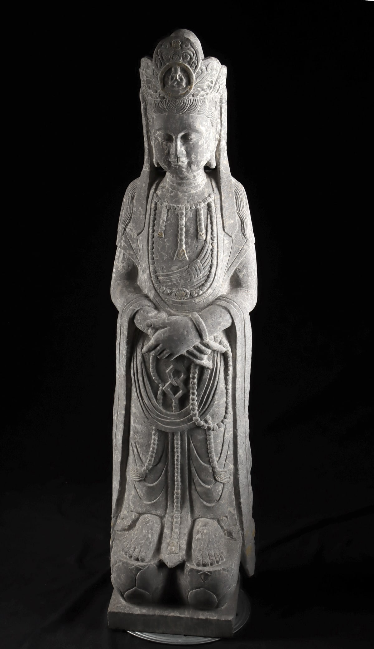 Chinese Stone Guanyin with Prayer Beads: East Asia, China, Republic period to early People's Republic period, ca. 20th century. A serene and finely carved stone sculpture depicting Guanyin, the Bodhisattva of Compassion, shown standing grace