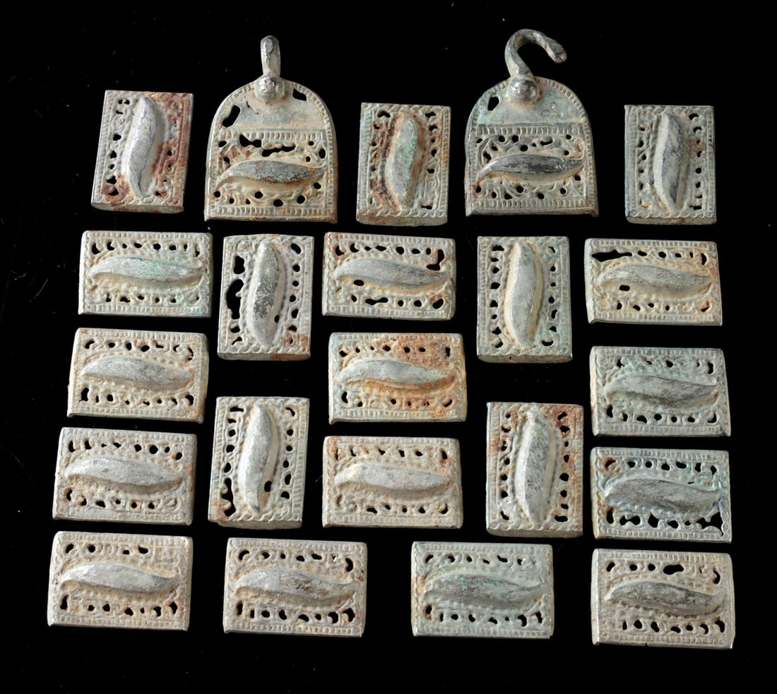 Ordos Bronze Belt Set with Openwork Plaques (22 pieces): Central Asia, Ordos region, steppe culture, ca. 4th to 2nd century BCE. A striking Ordos bronze belt set composed of twenty-two elements, including a hook and loop clasp and a series of rectangular pl