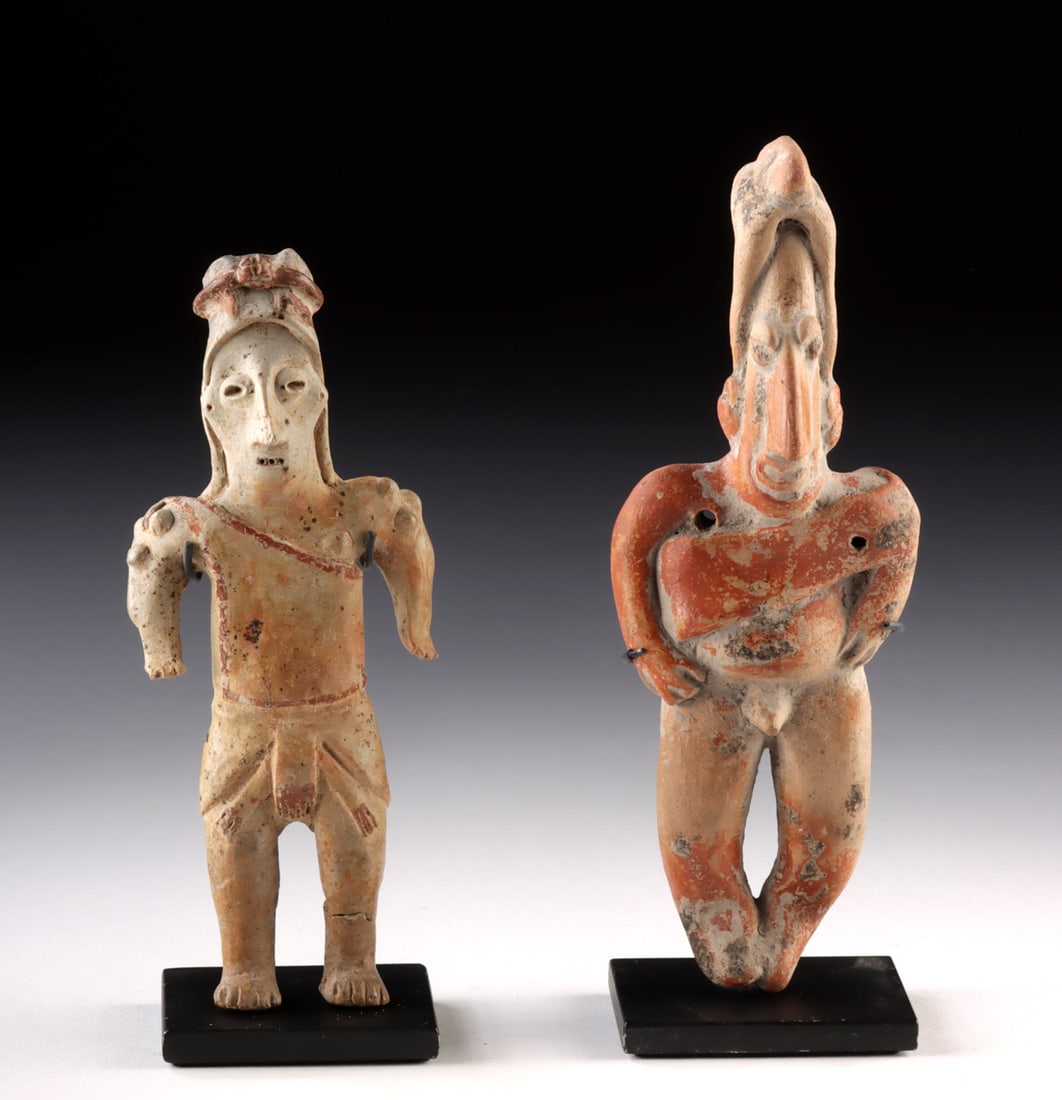 Two Jalisco Pottery Standing Male Figures: Pre-Columbian, West Mexico, Jalisco, ca. 300 BCE to 300 CE. A compelling pair of Jalisco pottery standing male figures representing the distinctive sculptural tradition associated with West Mexican sh