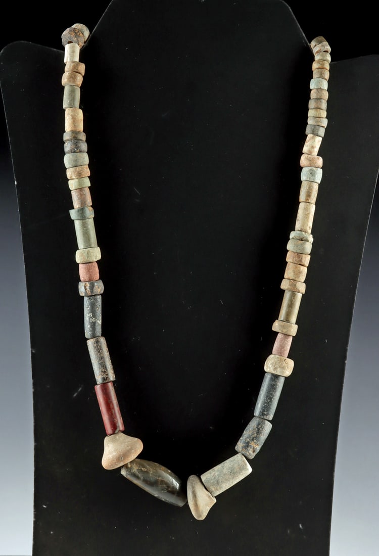 Pre-Columbian Stone & Pottery Bead Necklace: Pre-Columbian, Mesoamerica, ca. 500 BCE to 1200 CE. A varied strand of Pre-Columbian stone and pottery beads assembled on a modern cord to create a wearable necklace. The group includes cylindrical, d