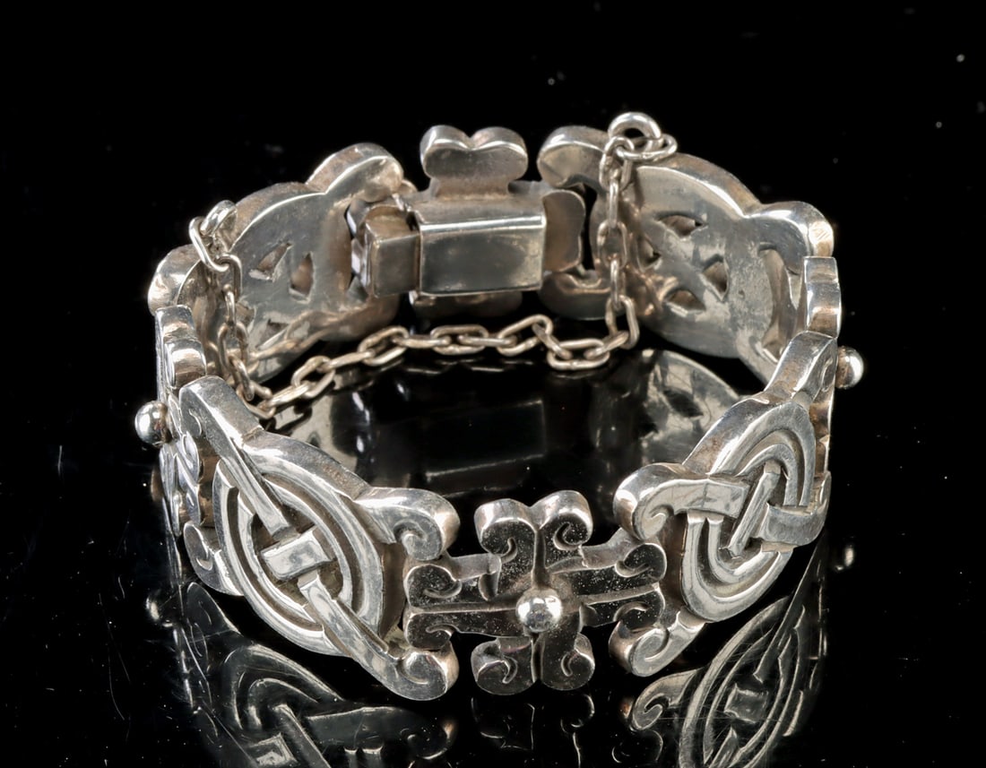 Spratling Sterling Silver Link Bracelet w/ Maya Motifs: William Spratling (American/expatriate in Mexico, 1900-1967). Produced by Sucesores de William Spratling. Silver bracelet, ca. 1979 or later. Marked with Spratling hallmark and "TS-24" (Mexican silver