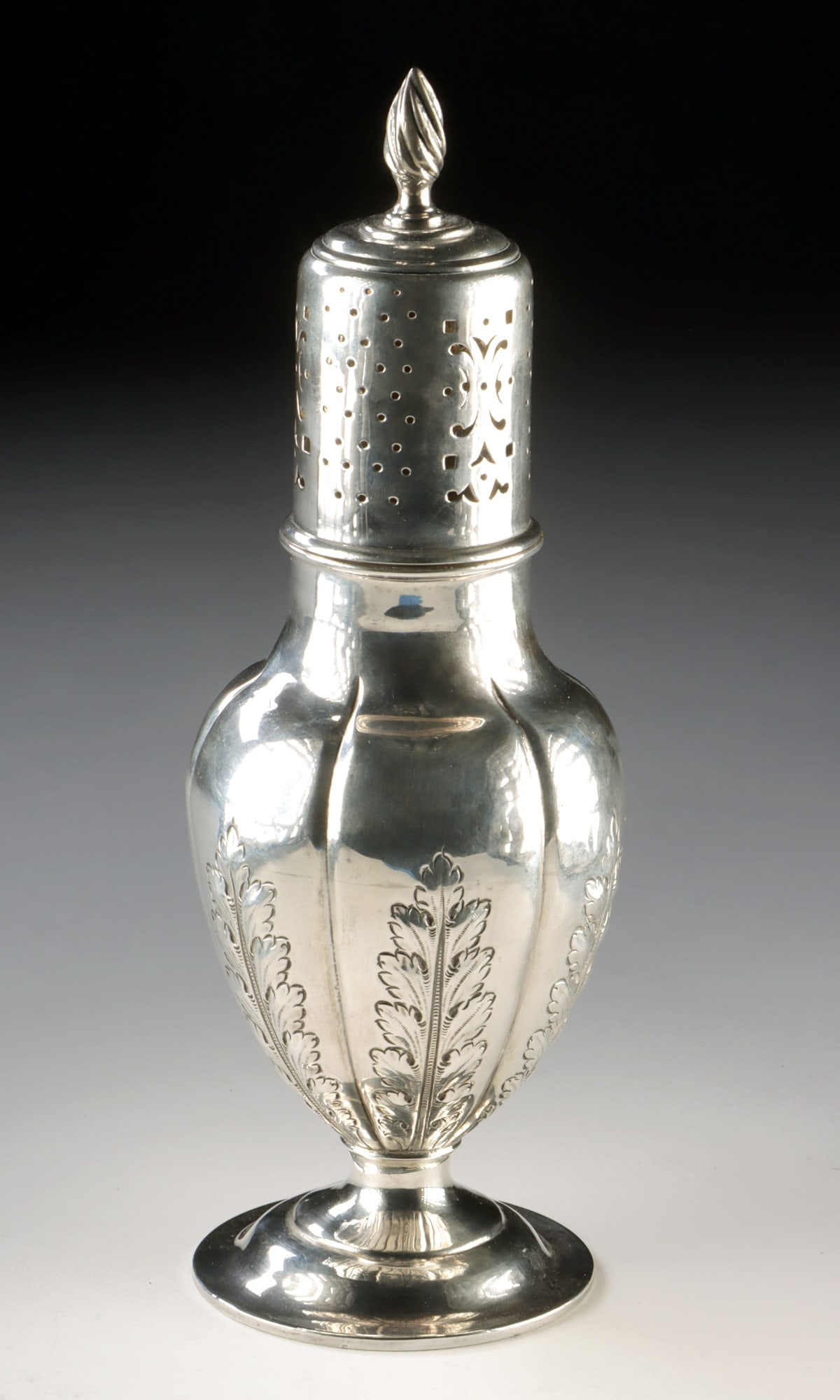 19th C. English Silver Sugar Caster - Victorian Period: Northern Europe, England, Victorian period, ca. 19th century CE. A graceful English Victorian silver sugar caster featuring a classic baluster form raised on a circular pedestal foot. The body is divi