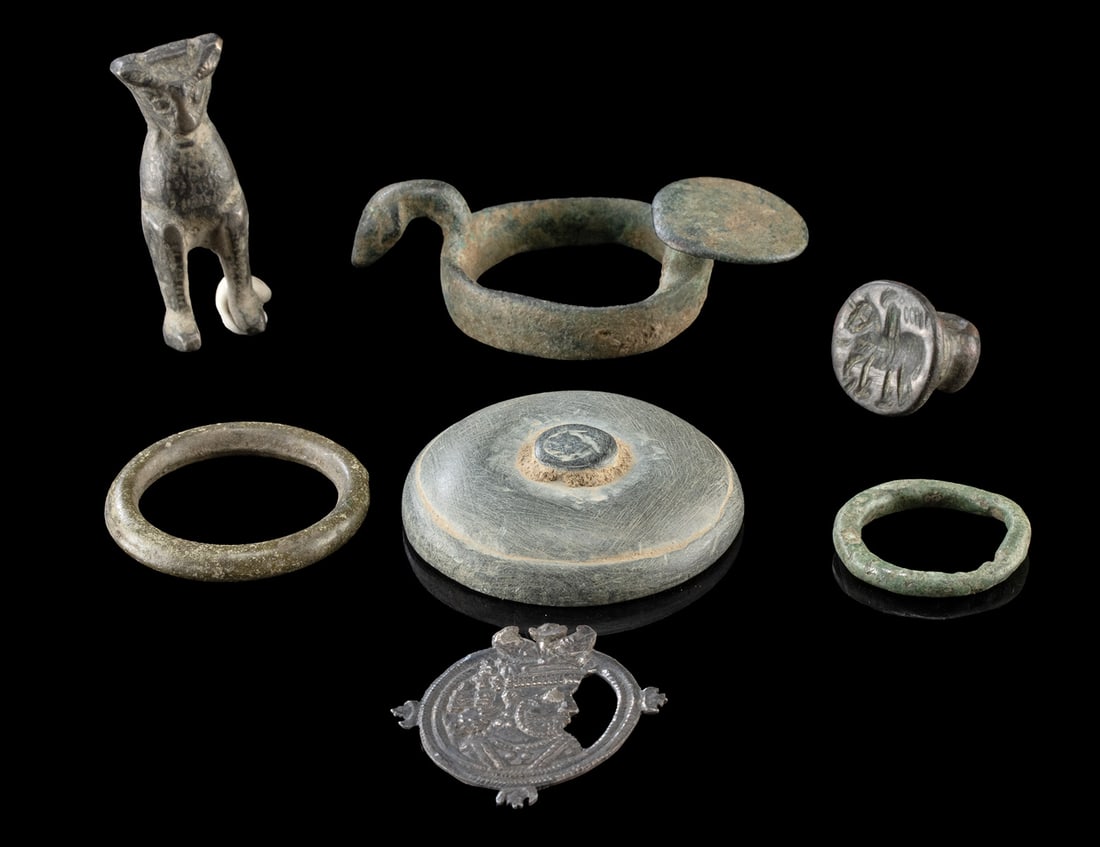 Ancient Persian & Kushan Bronze Fittings & Stone Lid: Near East / Central Asia, Iran (Persia), Afghanistan, Northern India, Bactria and Gandhara cultures, Kushan to Sasanian periods, ca. 2nd to 7th century CE. A small collection of ancient metal and ston