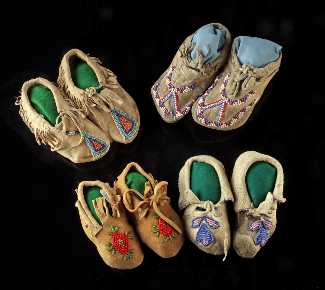 Native American Four Pairs of Child Beaded Moccasins: Native American, Northwestern United States, Washington, Oregon, Idaho, Plateau Tribes, Nez Perce, ca. early to mid-20th century CE. A group of four pairs of children's leather moccasins decorated wit