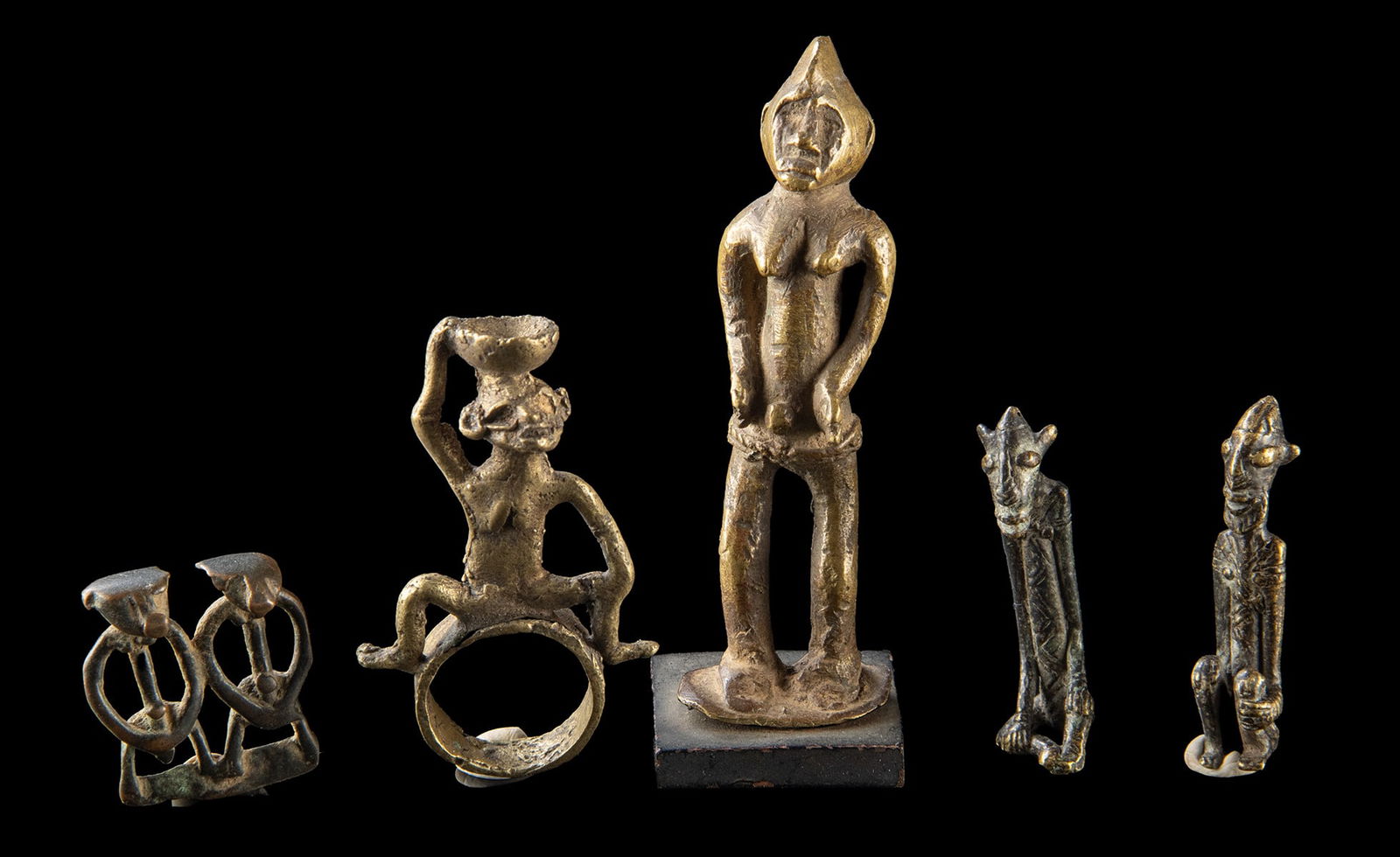 Lot of 5 Senufo and Dogon Brass Miniature Figures: West Africa, Senufo and Dogon peoples, ca. 20th century CE.A group of small brass miniature figures attributed to the Senufo and Dogon traditions of West Africa. The lot includes stylized human and an