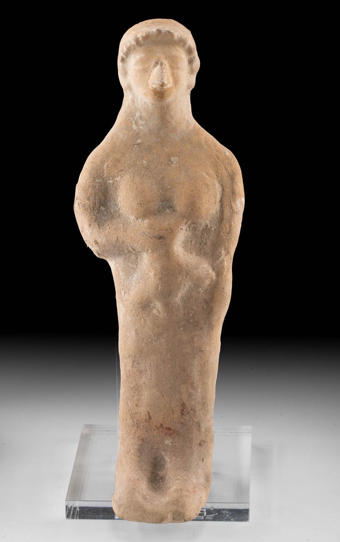Eastern Greek Archaic Terracotta Votive - Woman w/ Bird: Eastern Mediterranean, Ancient Greece, Eastern Greek, Archaic period, ca. 600 to 450 BCE. A sanctuary offering with real presence, this Eastern Greek terracotta figure presents a young woman holding