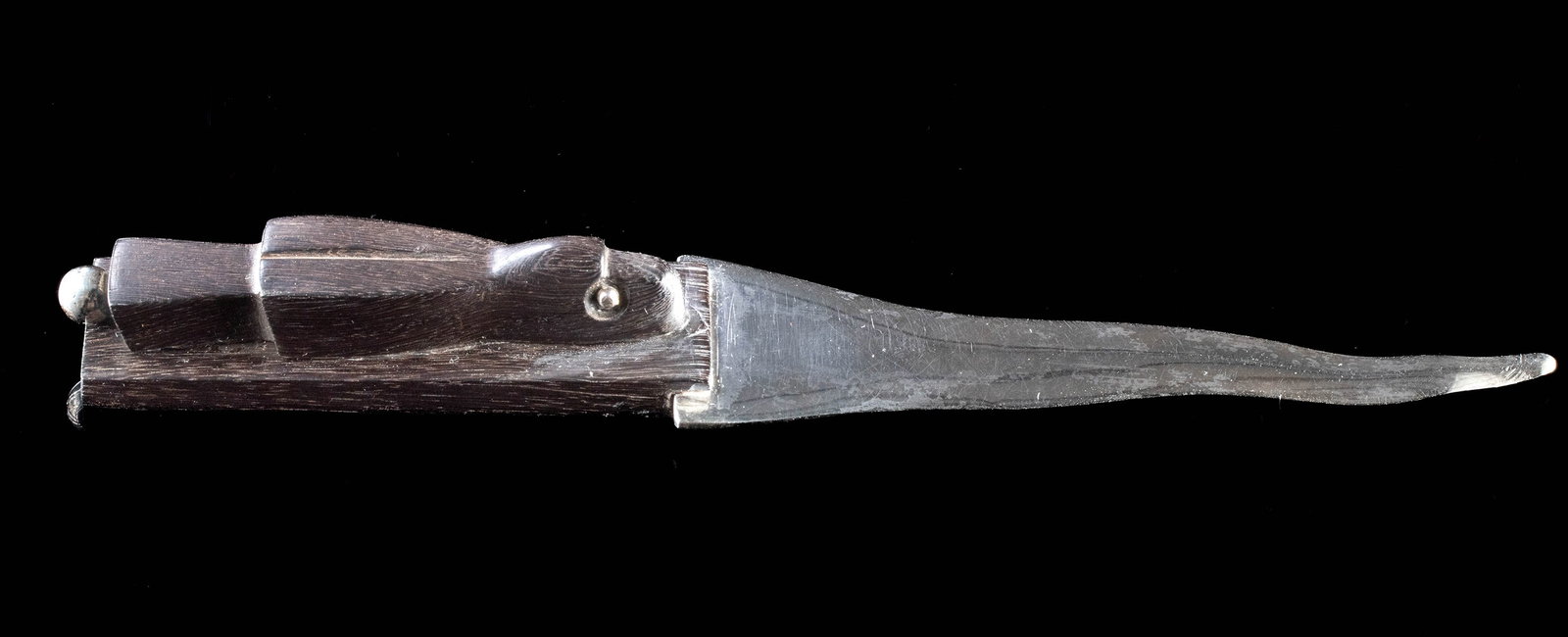 Spratling Sterling Silver & Ebony Handle Letter Opener: Latin America, Mexico, ca. after 1979 CE. An ebony wood handled letter opener with sterling silver blade, produced under the auspices of Sucesores de William Spratling. The carved wooden handle takes