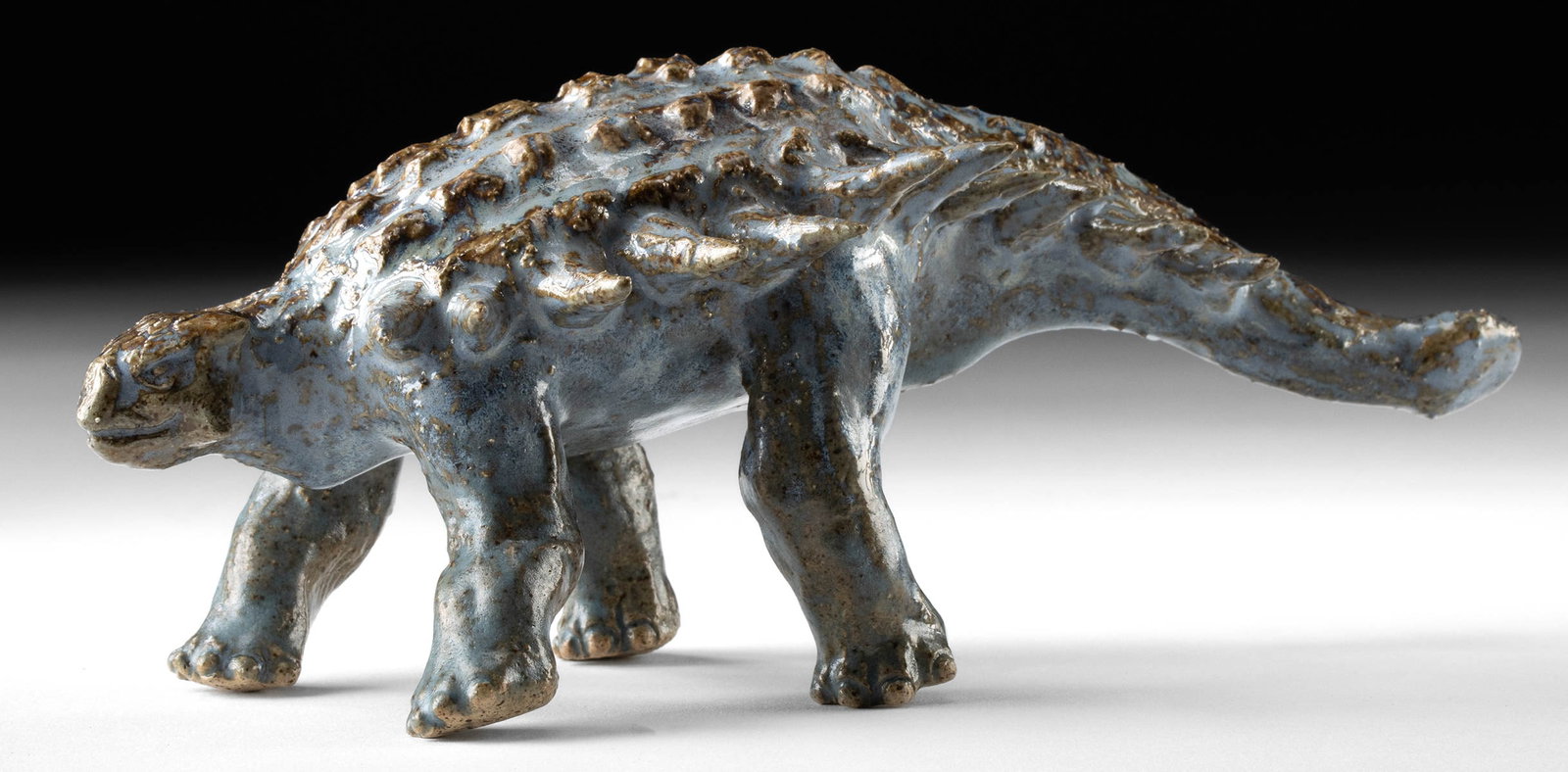 Joseph Gubocki Ceramic Ankylosaurus Sculpture: Joseph Gubocki (American, active XIX century). Ankylosaurus. Ceramic sculpture, n.d. Signed on underside near proper right front leg. A compact and spirited rendering of prehistoric armor, this cerami