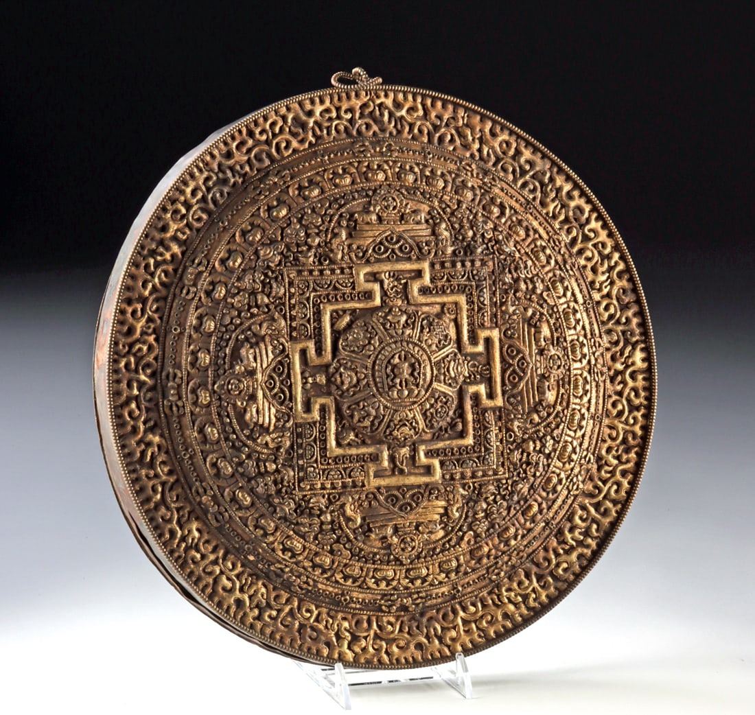 Copper Tantric Buddhist Mandala Meditation Plaque: Central Asia, Nepal / Tibet, ca. early to mid-20th century CE. A copper tantric mandala plaque with intricate repousse patterns forming a cosmic diagram of enlightenment, balance, and the ideal univer