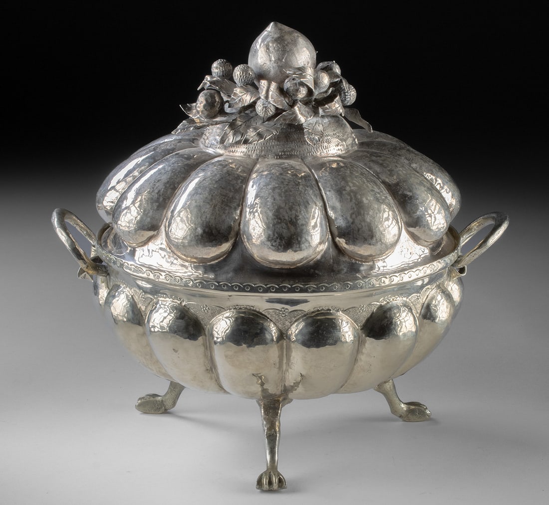 Andean Brass Lidded Coquera Pumpkin Form Vessel: South America, Peru / Bolivia, ca. late 19th to early 20th century CE. A large lobed nickel-brass coquera vessel of pumpkin or gourd form, raised on small feet and fitted with a domed lid. The surface