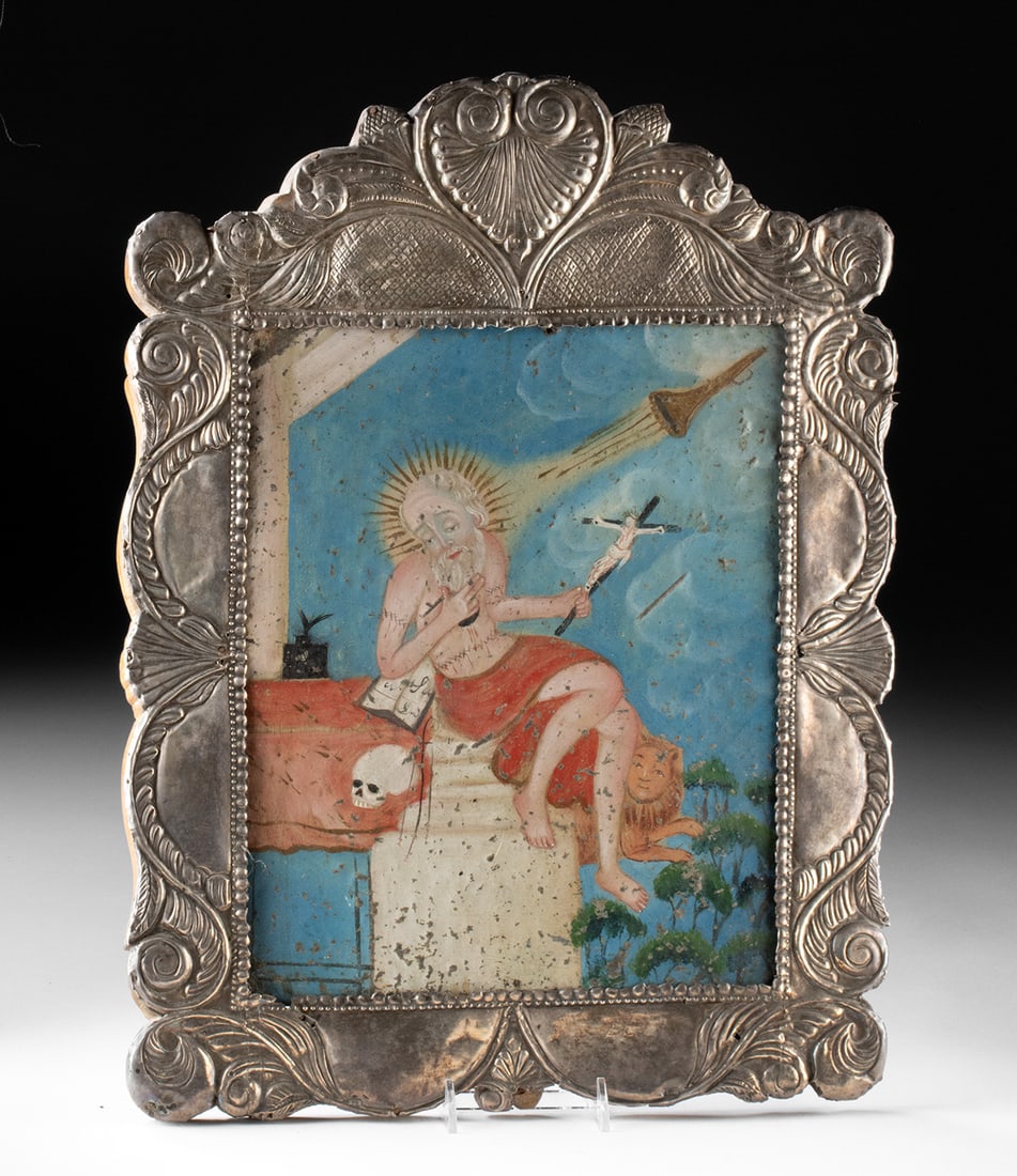 Mexican St. Jerome Retablo in Sterling Silver Frame: Latin America, Mexico, ca. early to mid-20th century CE. A devotional retablo depicting Saint Jerome seated in contemplation, holding a crucifix beside a skull and book, with a lion resting at his sid