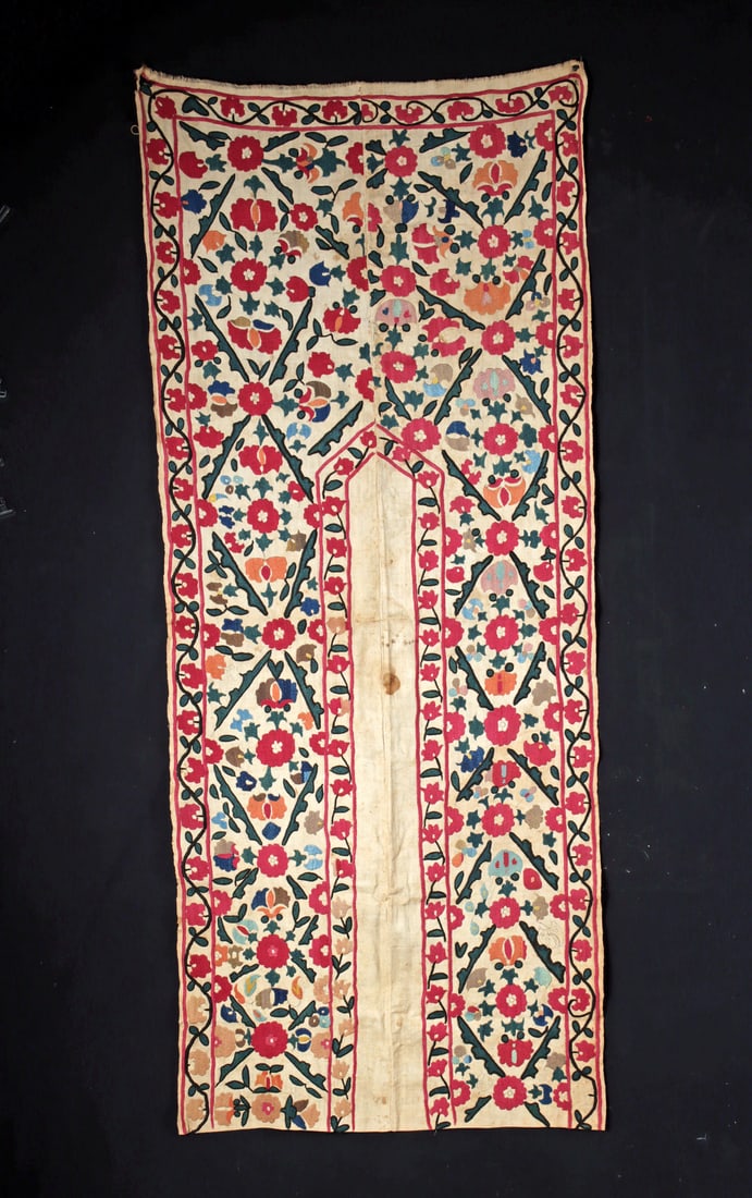 Uzbek Suzani Prayer Cloth with Floral Silk Embroidery: Central Asia, Tajikistan, Uzbekistan or Kazakhstan, Uzbek people, ca. 19th to early 20th century CE. A suzani cotton prayer cloth embroidered with silk couching in vibrant, symmetrical floral motifs a