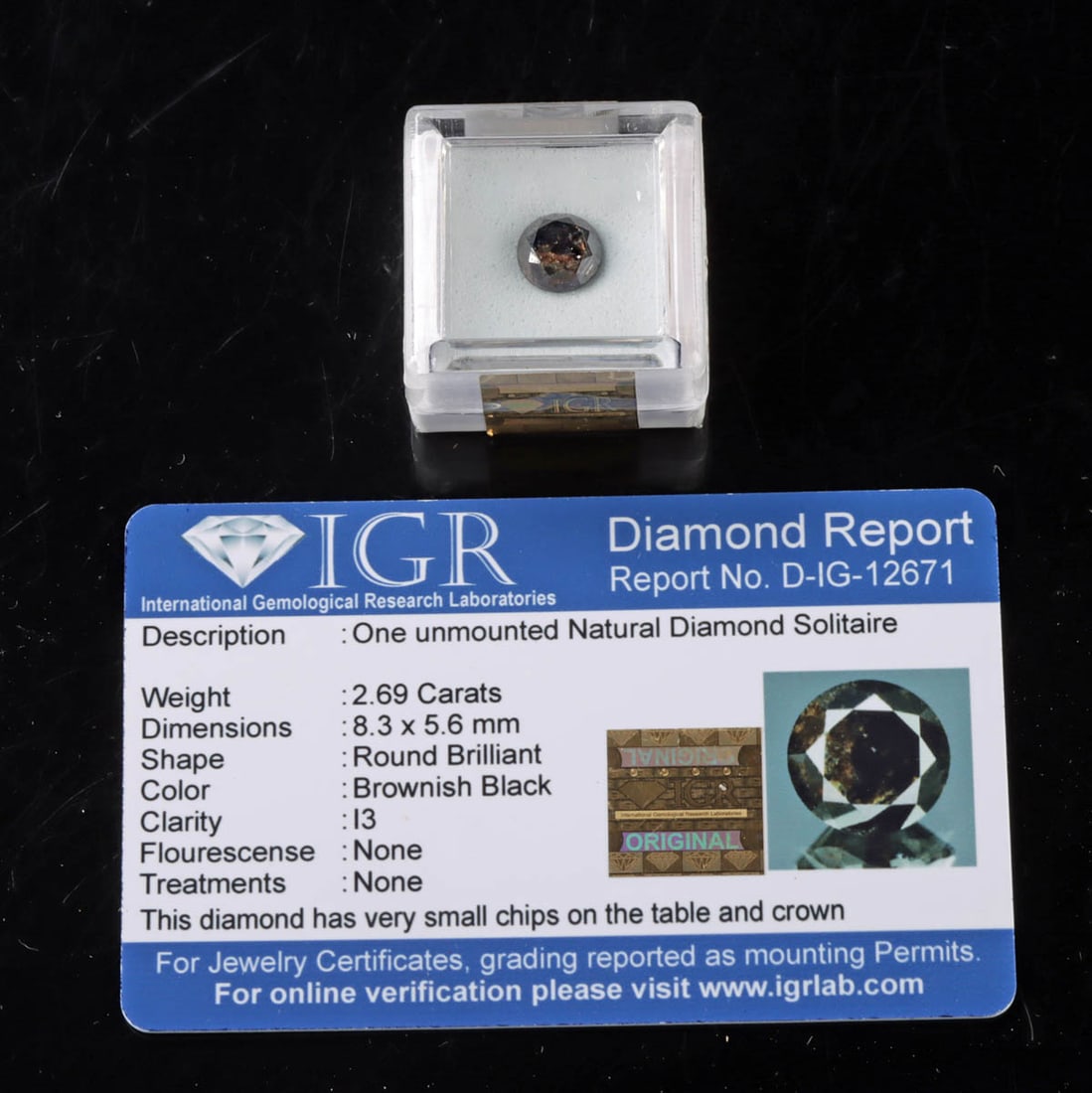 Unmounted Diamond 2.69 Carat Round Brilliant Black: United States, 21st century CE. An unmounted 2.69 carat diamond suitable for collectors, custom jewelry, or alternative engagement designs. The stone is a round brilliant cut with a mottled black-brow
