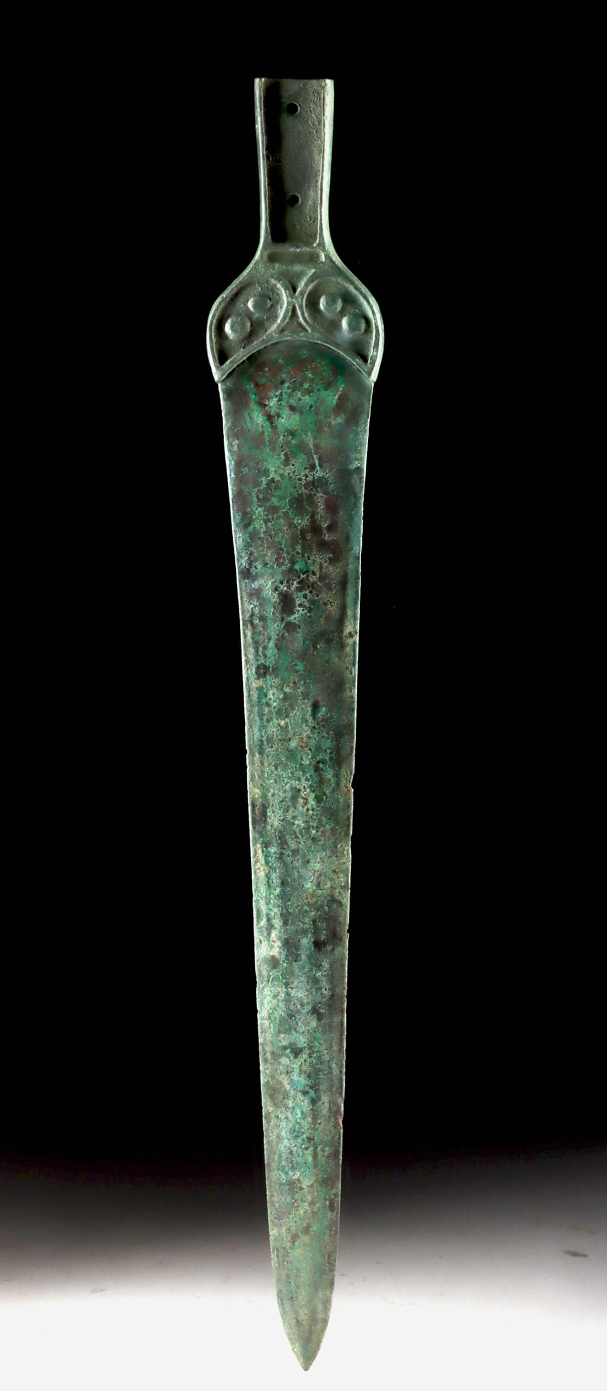 Late Bronze-Age Flange-Hilted Dagger (Dirk): Denmark or northern Europe, late Bronze age, ca. 1300-900 BCE. Cast in one piece with a long, straight tapering blade of triangular section, widening slightly at the shoulders and continuing into a fl