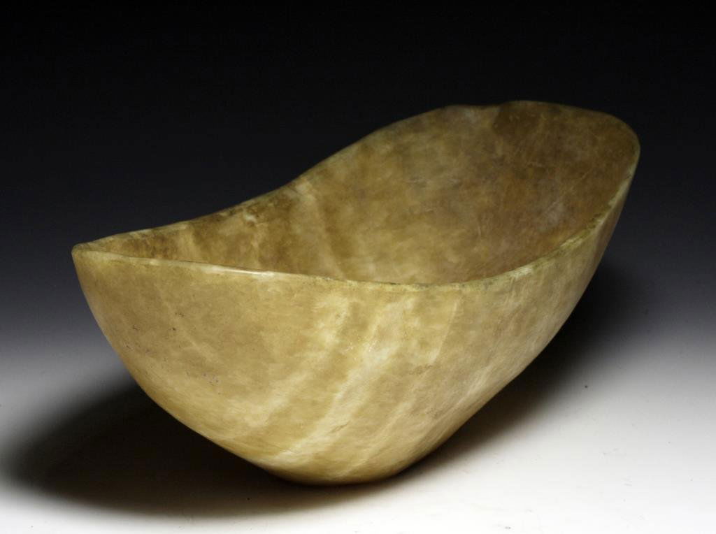 Bactrian Banded Alabaster Boat-Shaped Basin: Near East, Bactria, ca. 2nd Millennium BCE. Large carved basin in the shape of a boat with flat platform bottom. 12-1/4"L x 5-3/4"H Provenance: Ex-Private German Collection. Authenticity Guaranteed Th
